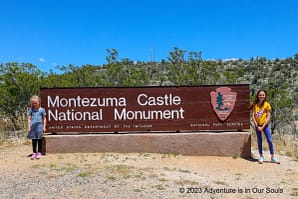 Spider Monkey and Buttercup at Montezuma Castle NM sign